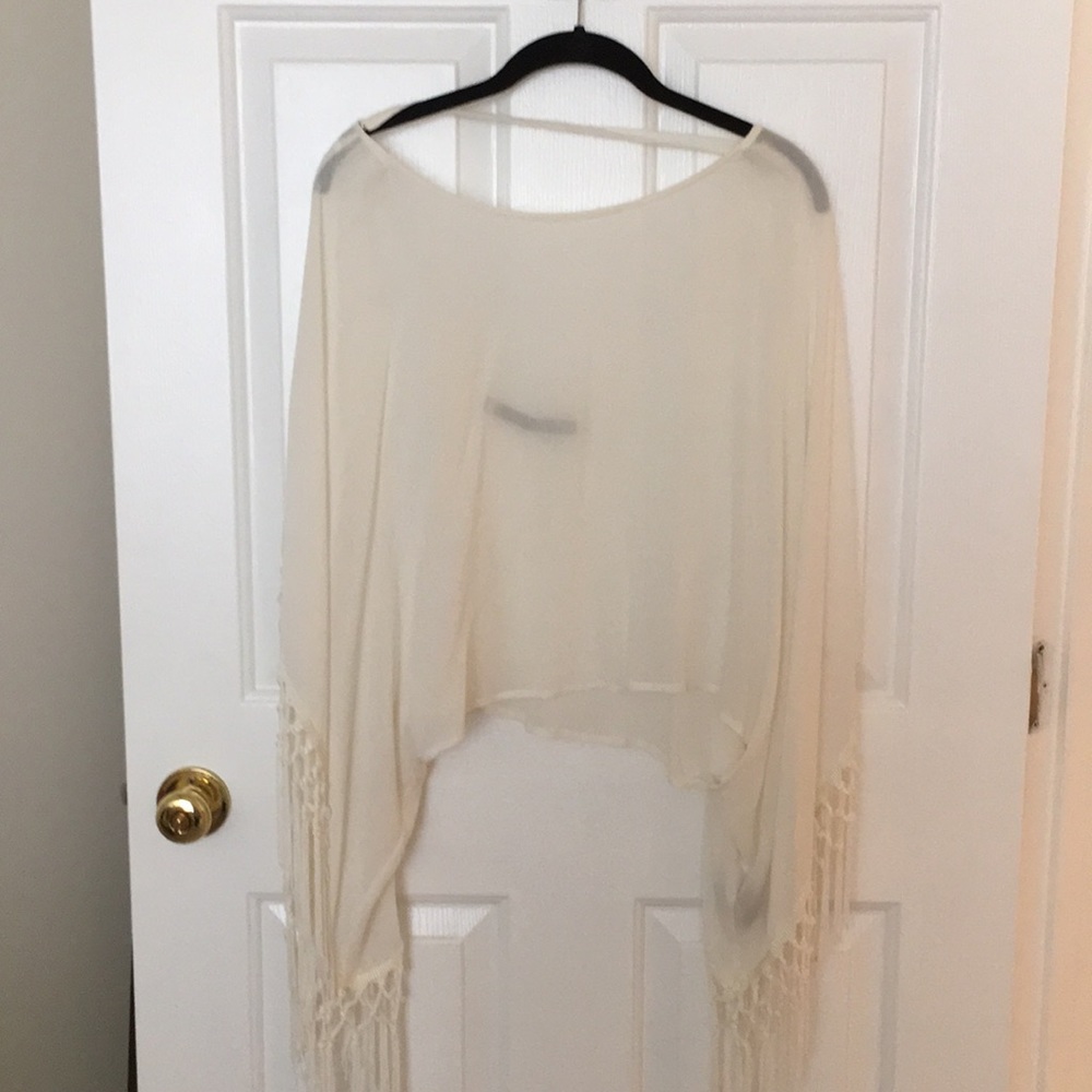 White fringe wide sleeve crop top.